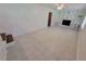 Spacious living area with a fireplace, built-in shelving, neutral paint, and tile flooring perfect for comfortable living at 2206 Rhett Ct, Lawrenceville, GA 30044