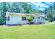 Charming exterior of this well-maintained house featuring a cozy front porch at 5160 W Chapel Hill Rd, Douglasville, GA 30135