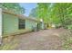 Side backyard of home and view of greenery and trees at 5273 Martins Crossing Rd, Stone Mountain, GA 30088