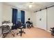 Bedroom featuring barn doors and dark curtains, plus office furniture at 5273 Martins Crossing Rd, Stone Mountain, GA 30088