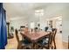 Dining room has large wooden table and chairs and hardwood flooring at 5273 Martins Crossing Rd, Stone Mountain, GA 30088