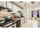 Kitchen features stainless steel appliances, white cabinets and tile backsplash at 5273 Martins Crossing Rd, Stone Mountain, GA 30088