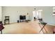 Bright living room boasts light-colored walls and floors plus a pass-through to another room at 5273 Martins Crossing Rd, Stone Mountain, GA 30088