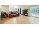 Bright living room with hardwood floors, fireplace and sliding doors to patio at 5273 Martins Crossing Rd, Stone Mountain, GA 30088