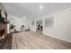Finished basement with modern lighting, fireplace, and wood-look flooring at 1035 Hunterhill Dr, Roswell, GA 30075