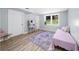 Spare bedroom featuring a vanity, neutral walls, and wood-look flooring at 1035 Hunterhill Dr, Roswell, GA 30075