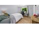 Bedroom features hardwood floors and a desk area perfect for studying or working from home at 1035 Hunterhill Dr, Roswell, GA 30075