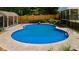 Private backyard pool with a concrete surround is perfect for relaxing and entertaining guests in a park-like setting at 1035 Hunterhill Dr, Roswell, GA 30075