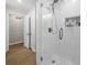 Updated shower with white subway tile, glass door, and a convenient built-in niche at 1035 Hunterhill Dr, Roswell, GA 30075