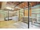 Spacious unfinished basement with washer, dryer, storage shelves, and concrete flooring at 2473 Melinda Ne Dr, Atlanta, GA 30345