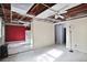 Unfinished basement area featuring white tile floor and exposed ceiling at 2473 Melinda Ne Dr, Atlanta, GA 30345