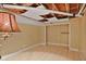Spacious basement with tile flooring, drop ceiling and closet with shelving at 2473 Melinda Ne Dr, Atlanta, GA 30345