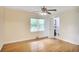 Comfortable bedroom with a ceiling fan, hardwood floors, and an ensuite bathroom at 2473 Melinda Ne Dr, Atlanta, GA 30345