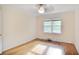 Bright bedroom featuring a ceiling fan, hardwood floors, and a window with natural light at 2473 Melinda Ne Dr, Atlanta, GA 30345