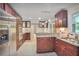 Well-equipped kitchen with rich wood cabinetry, stainless steel appliances, and granite countertops at 2473 Melinda Ne Dr, Atlanta, GA 30345