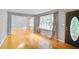 Inviting living room with gleaming hardwood floors, neutral paint, and large windows offering natural light at 2473 Melinda Ne Dr, Atlanta, GA 30345