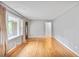 Bright living room with neutral walls, hardwood floors, and natural light from the large front window at 2473 Melinda Ne Dr, Atlanta, GA 30345