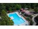 Aerial view of the pool, outdoor lounge areas, and manicured landscaping surrounding the complex at 795 Hammond Dr # 506, Sandy Springs, GA 30328