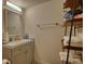 Updated bathroom features a modern vanity, mirror, and stylish storage shelves at 795 Hammond Dr # 506, Sandy Springs, GA 30328