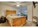 Spacious bedroom featuring a large bed and a window, with a ceiling fan at 795 Hammond Dr # 506, Sandy Springs, GA 30328