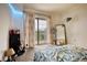 Comfortable bedroom featuring a sliding glass door and comfortable decor with plenty of sunlight at 795 Hammond Dr # 506, Sandy Springs, GA 30328