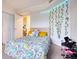 Bright bedroom features soft carpet, a decorative wall, and a closet for storage at 795 Hammond Dr # 506, Sandy Springs, GA 30328