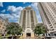 High-rise building featuring balconies and mature trees at 795 Hammond Dr # 506, Sandy Springs, GA 30328