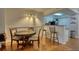 Open floorplan view of the dining area with bar stools and a view into the kitchen at 795 Hammond Dr # 506, Sandy Springs, GA 30328