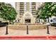 Exterior of the building featuring a water fountain and manicured landscaping at 795 Hammond Dr # 506, Sandy Springs, GA 30328