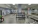 Bright community gym featuring cardio machines, weights, fitness equipment, and mounted televisions at 795 Hammond Dr # 506, Sandy Springs, GA 30328