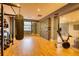 Bright gym offering modern equipment like a rower, weights, and a climbing wall for diverse exercise routines at 795 Hammond Dr # 506, Sandy Springs, GA 30328