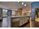 Modern kitchen featuring an island with granite countertops and stainless steel appliances at 795 Hammond Dr # 506, Sandy Springs, GA 30328