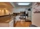 Well-lit kitchen features stainless steel appliances and a mix of granite countertops and white cabinetry at 795 Hammond Dr # 506, Sandy Springs, GA 30328