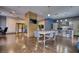 Stylish community lounge with a large table, full kitchen, and contemporary design at 795 Hammond Dr # 506, Sandy Springs, GA 30328