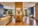 Inviting lounge with wood floors, elegant furnishings, accent wall, and dining area with bar stools at 795 Hammond Dr # 506, Sandy Springs, GA 30328
