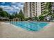 A large community pool featuring lounge chairs, a covered area and meticulously maintained grounds at 795 Hammond Dr # 506, Sandy Springs, GA 30328