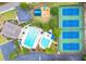 Aerial shot of community amenities with pool, tennis courts, playground, and parking at 2167 Merrymount Dr, Suwanee, GA 30024