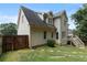 Back view of home and yard including a deck and fenced area at 2167 Merrymount Dr, Suwanee, GA 30024