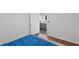 Comfortable bedroom with hardwood floors offering a glimpse into the spacious living area beyond at 2167 Merrymount Dr, Suwanee, GA 30024