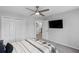 Cozy bedroom featuring a spacious closet and mounted television at 2167 Merrymount Dr, Suwanee, GA 30024