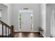 Inviting foyer with hardwood floors, a white front door with sidelights, and classic trim at 2167 Merrymount Dr, Suwanee, GA 30024