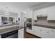 Bright kitchen view featuring stainless steel appliances, sleek countertops, and ample cabinet space at 2167 Merrymount Dr, Suwanee, GA 30024