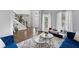 Inviting living room with hardwood floors, bright windows, and a view of the foyer at 2167 Merrymount Dr, Suwanee, GA 30024