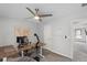 Bright home office with a world map on the wall and an adjustable standing desk at 2167 Merrymount Dr, Suwanee, GA 30024