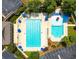Overhead aerial view of a community pool and lounging area with chairs and umbrellas at 2167 Merrymount Dr, Suwanee, GA 30024