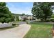 A street view displays charming homes, lush greenery, and a serene neighborhood ambiance at 2167 Merrymount Dr, Suwanee, GA 30024