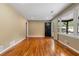 Spacious living room featuring hardwood floors, neutral walls, and a view of the front porch at 2266 Kennedy Nw Ct, Atlanta, GA 30318