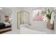 Bathroom showcasing a soaking tub with gold-trimmed shower and view to a bedroom at 4085 Tritt Homestead Dr, Marietta, GA 30062