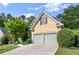 Charming home with a two-car garage, a well-kept lawn, and lush landscaping at 4085 Tritt Homestead Dr, Marietta, GA 30062