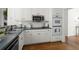 Kitchen features white cabinetry, a stainless steel microwave, and a built-in wall oven at 4085 Tritt Homestead Dr, Marietta, GA 30062